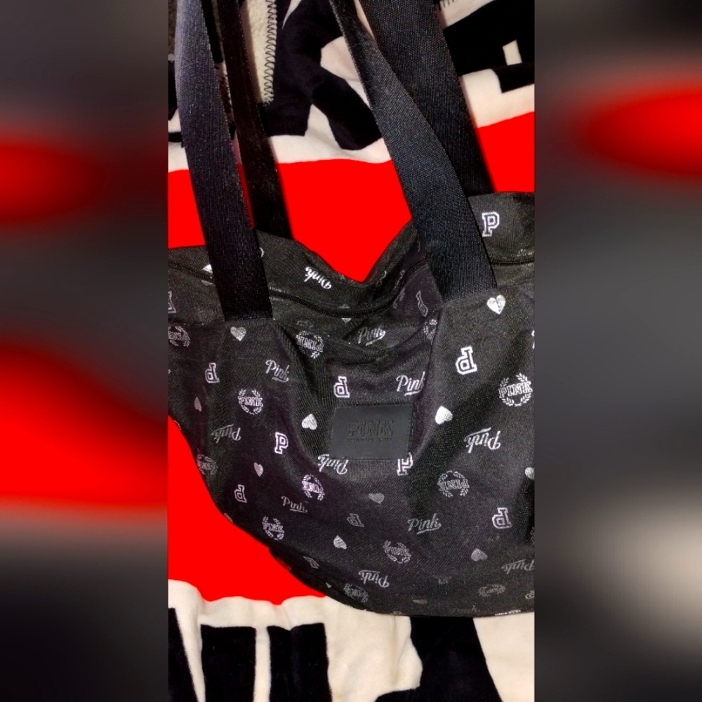 Pink 🩷 by Victoria Secret. Material black canvas with silver pink Logo all over